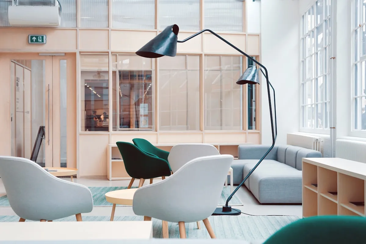 Compact bedroom workspace utilizing a wall-hung floating wooden desk with zero floor obstruction