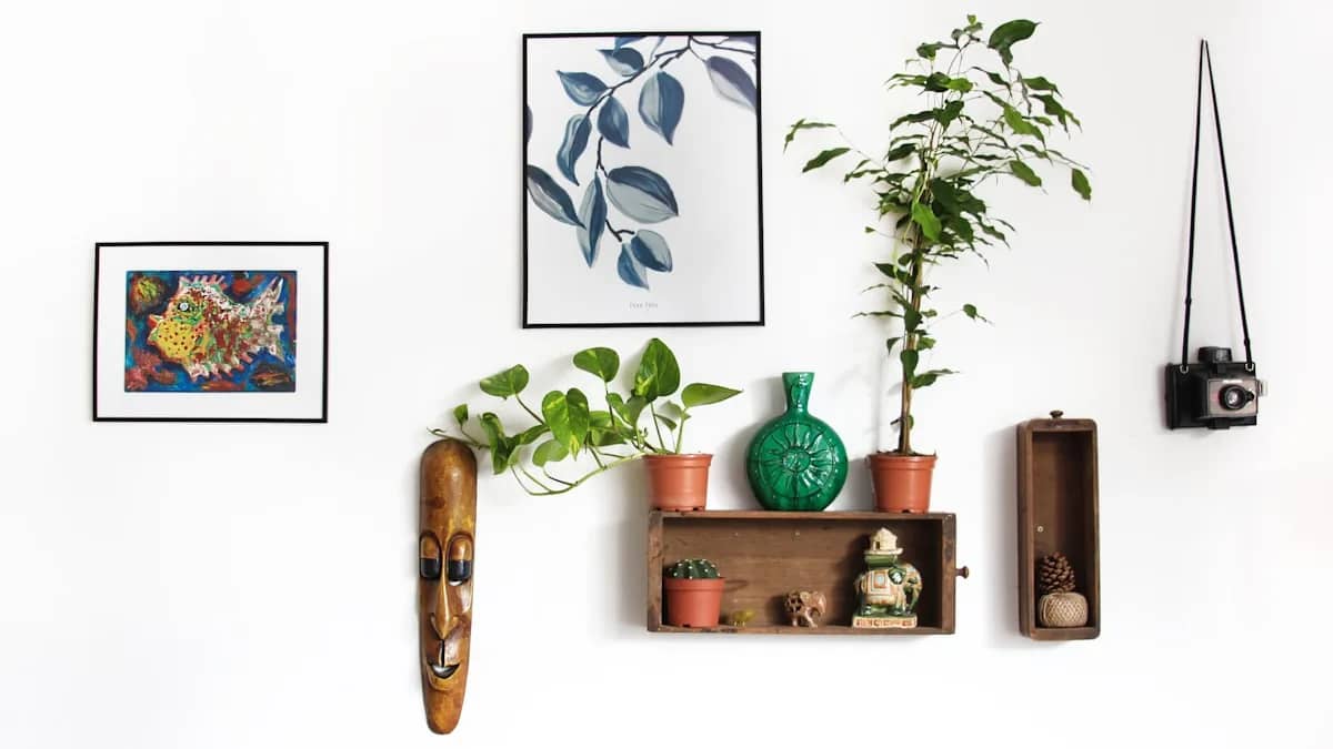 Restored historic interior living room with framed pictures hung cleanly on historic plaster walls
