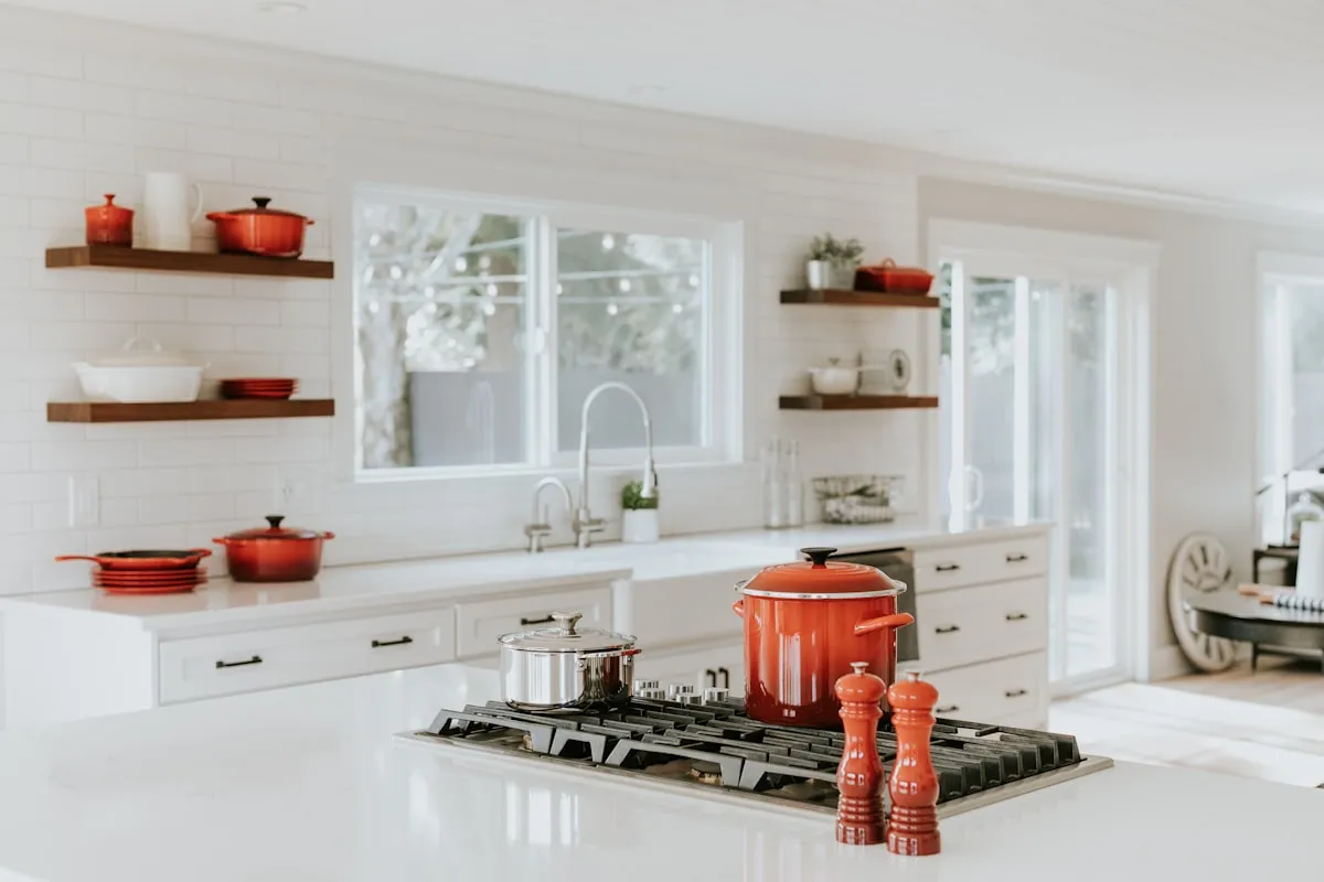 Modern kitchen interior showing temporary upgrades including clean subway tile backsplash and modern cabinet hardware