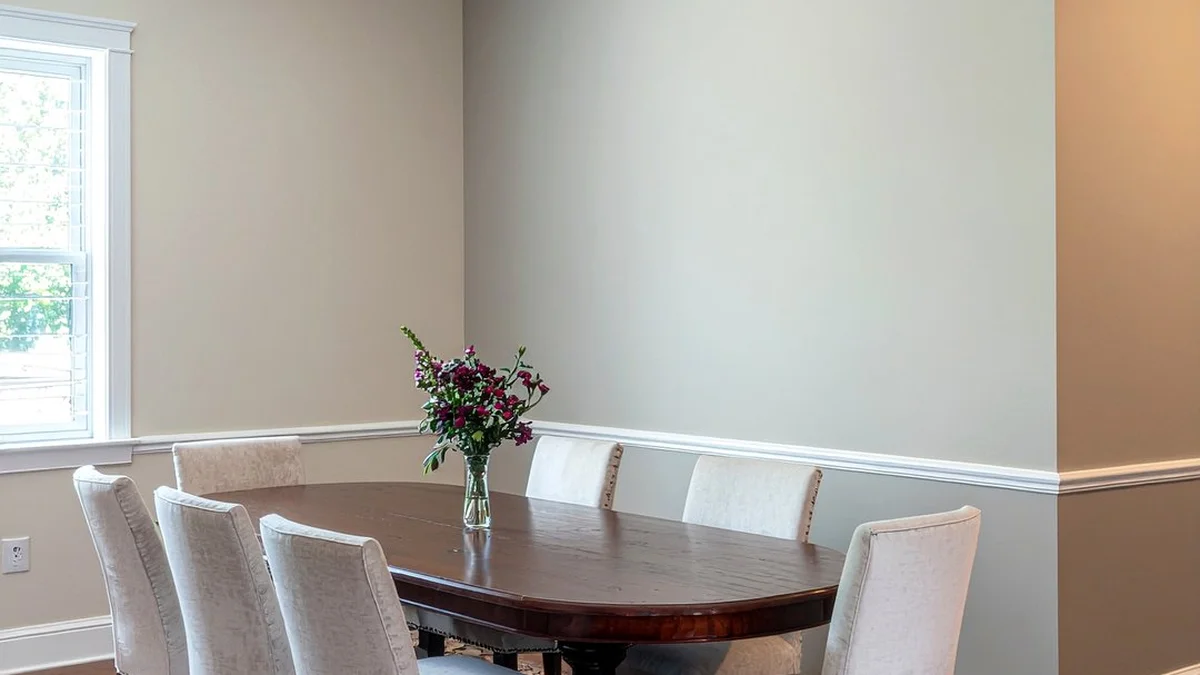 Formal dining room with eight-foot ceiling showing white chair rail moulding installed at thirty-two inches